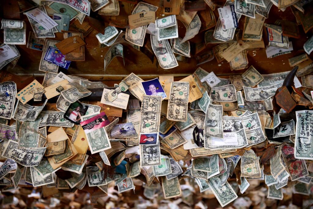 Personalized dollar bills hang from the ceiling at Washoe House in Petaluma on Wednesday, November 21, 2018. (BETH SCHLANKER/ The Press Democrat)