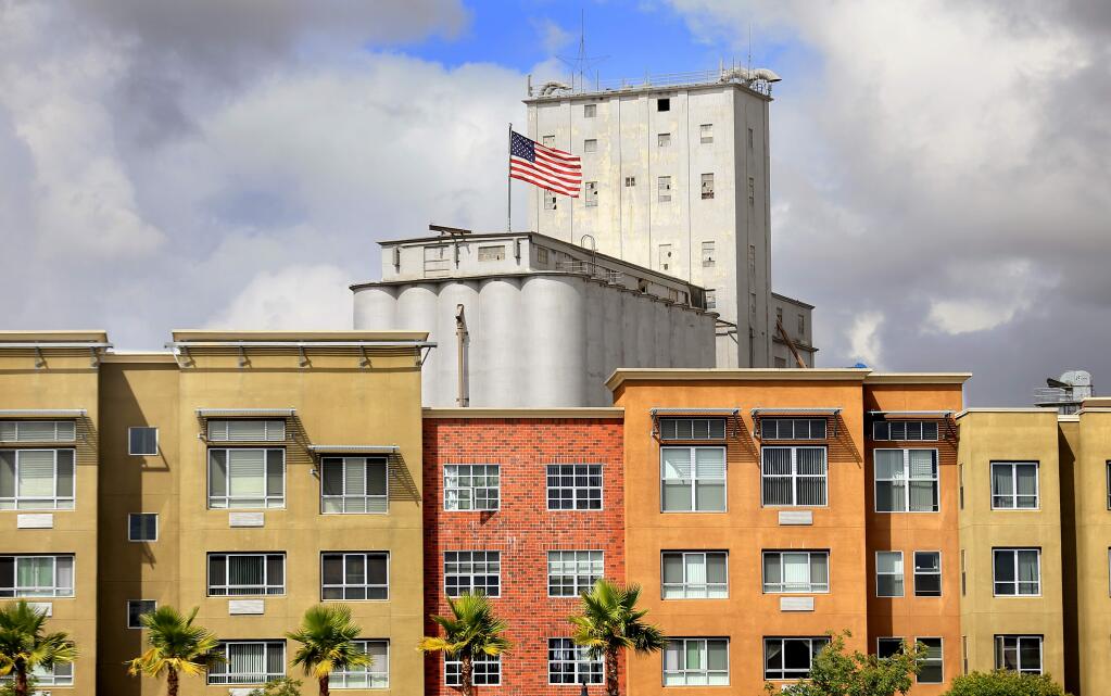 Dairyman's Feed and Supply, the tallest structure in Petaluma, is seen above a Washington Street apartment complex. (KENT PORTER/ PD FILE)