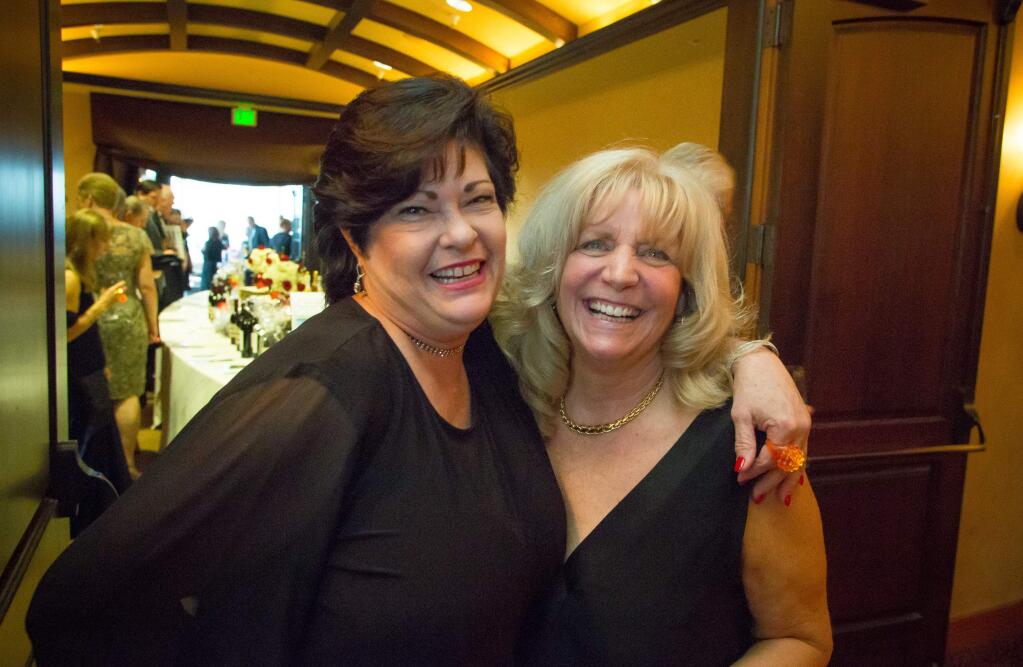 CASA VP of the Board, Roni Brown, left, and executive directer Millie Gilson attend the Hearts for Children Fundraiser at the Vintners Inn in Santa Rosa, Calif. Saturday, March 18, 2017. (Jeremy Portje / For The Press Democrat)