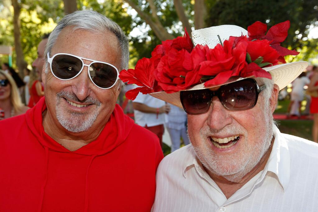 Michael Franks, left, and Simon Blattner attend the Red and White Ball fundraiser for Sonoma Valley Education Foundation, in Sonoma, California on Saturday, August 27, 2016. (Alvin Jornada / The Press Democrat)