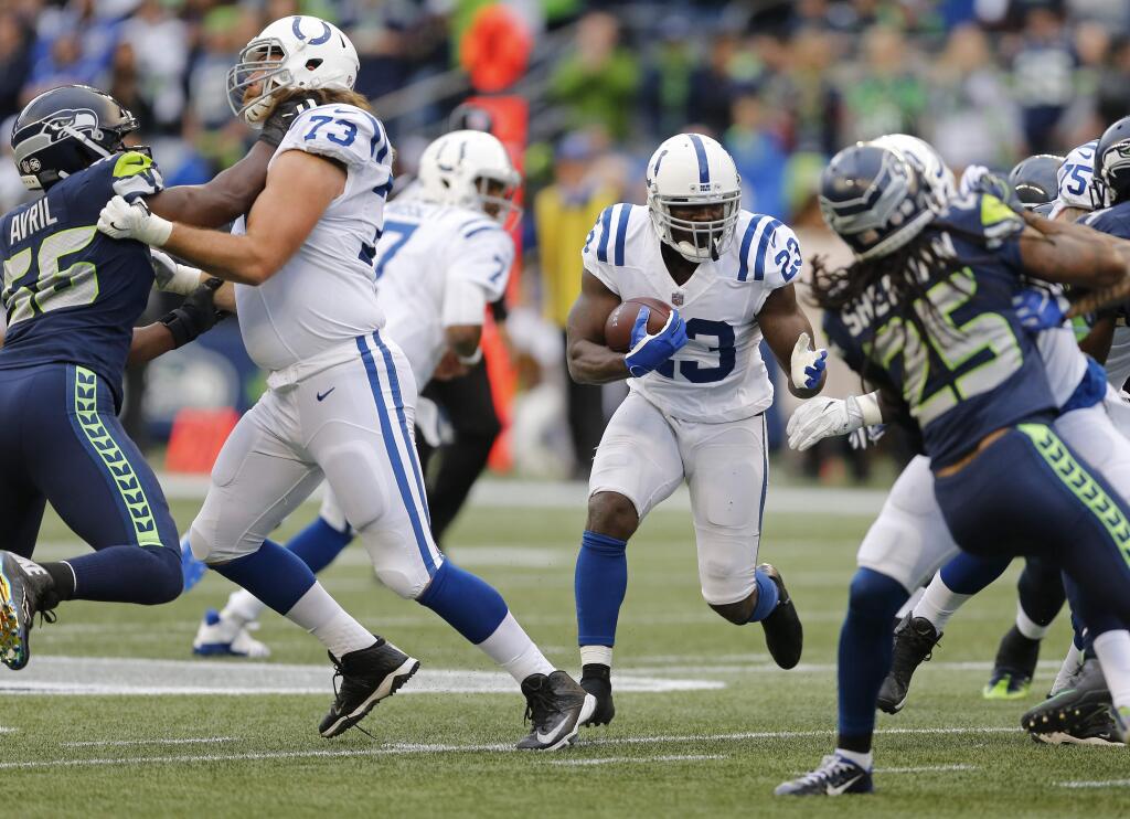 Indianapolis Colts running back Frank Gore rushes against the Seattle Seahawks in the first half Sunday, Oct. 1, 2017, in Seattle. (AP Photo/Stephen Brashear)