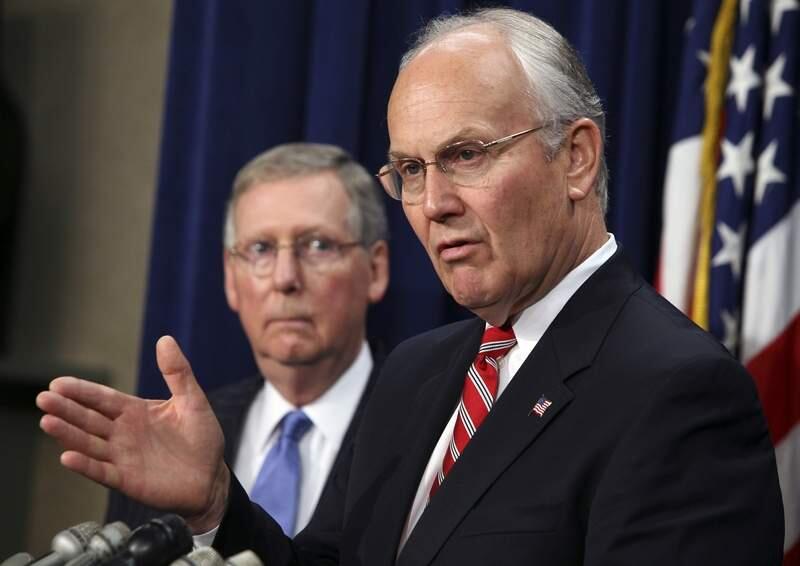 *FILE PHOTO*(NYT61) WASHINGTON -- August 27, 2007 -- SENATOR-ARREST -- Sen. Larry Craig, (R-Idaho), front, gestures with Senate Minority Leader Mitch McConnell, during a news conference about theenergy bill, on Capitol Hill, Thursday, June 14, 2007. Craig was arrested in June by an undercover police officer in a men's bathroom at Minneapolis-St. Paul International Airport, and pleaded guilty to disorderly conduct in the case three weeks ago. (Doug Mills/The New York Times)