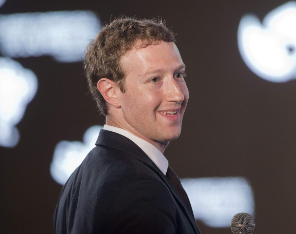 Facebook CEO Mark Zuckerberg asks a question during the CEO Summit of the Americas panel discussion in Panama City, Panama, Friday, April 10, 2015. (AP Photo/Pablo Martinez Monsivais)