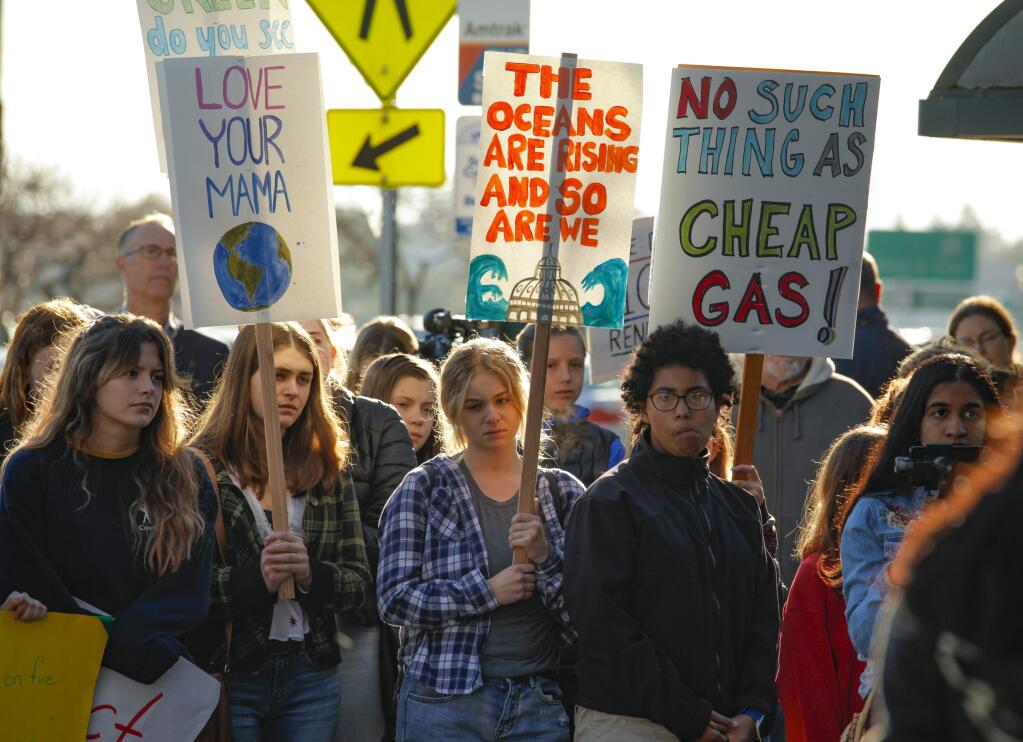 Petaluma, CA, USA._Friday, March 15, 2019. Students from Petaluma schools participated in a rally and protest over climate change and the current administration's environmental policies. The 'climate strikers' walked out of school and marched on East Washington after listening to speakers. (CRISSY PASCUAL/ARGUS-COURIER STAFF)