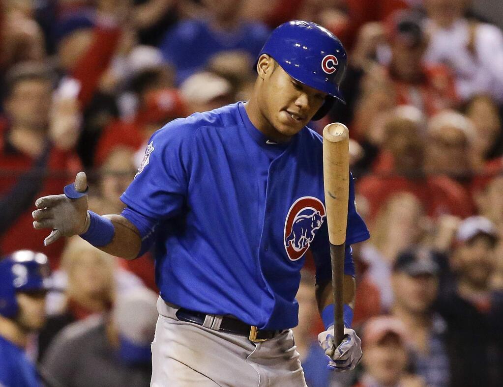 Chicago Cubs' Addison Russell reacts after striking out during the eighth inning of Game 1 in baseball's National League Division Series against the St. Louis Cardinals, Friday, Oct. 9, 2015, in St. Louis. (AP Photo/Jeff Roberson)