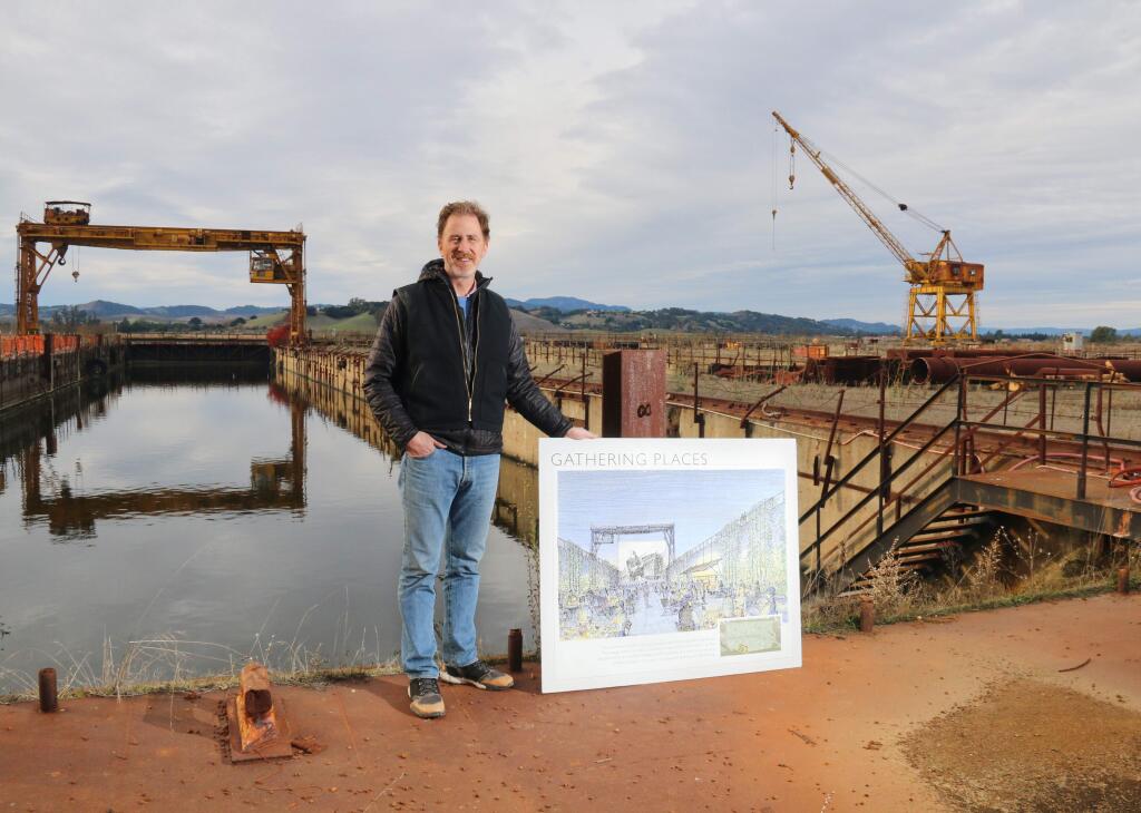 Keith Rogal of Napa Redevelopment Partners shows an architectural rendering of how one of four drydocks at the Napa Pipe project at 1025 Kaiser Road would be repurposed as an events and dining space. The overhead and swivel cranes of the original industrial facility are seen on Monday, Dec. 3, 2018. (JEFF QUACKENBUSH / NORTH BAY BUSINESS JOURNAL)