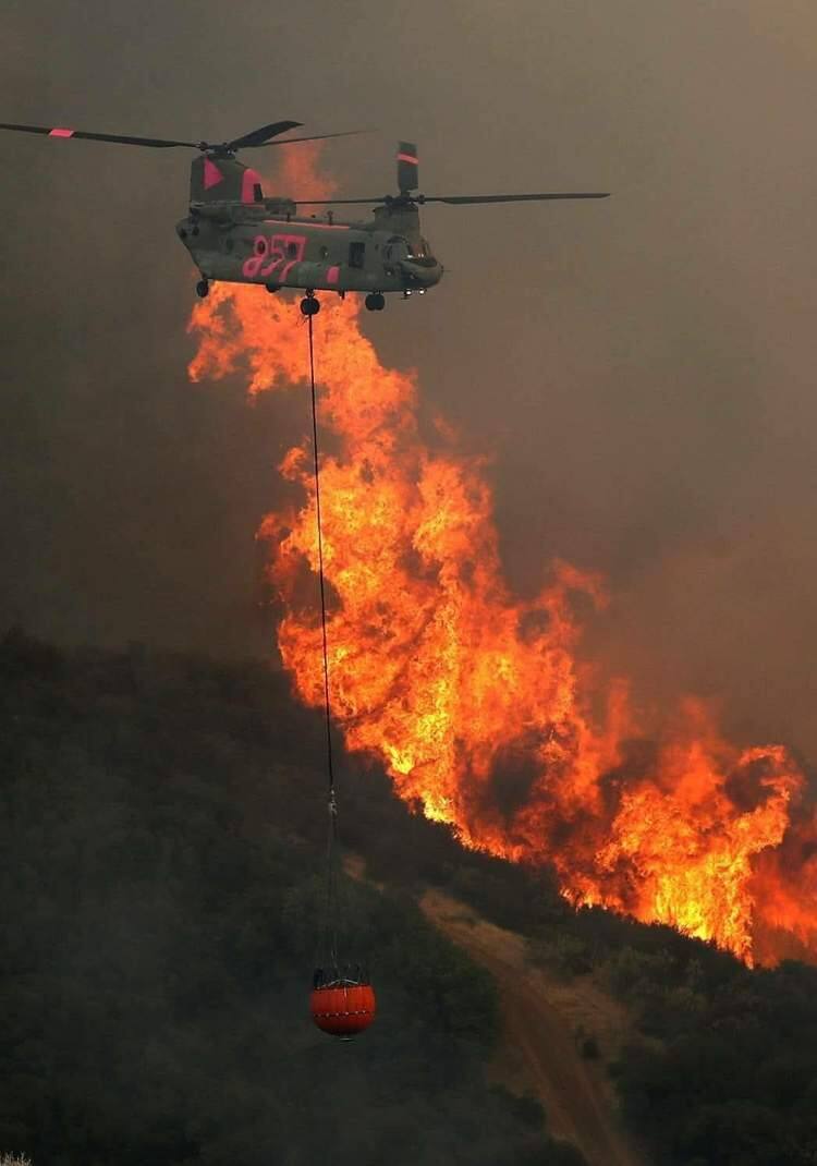 A helicopter is used to fight the raging Mendocino Complex fires on Sunday, Aug. 12, 2018. (ANGELA MENDOZA/ US FOREST SERVICE)