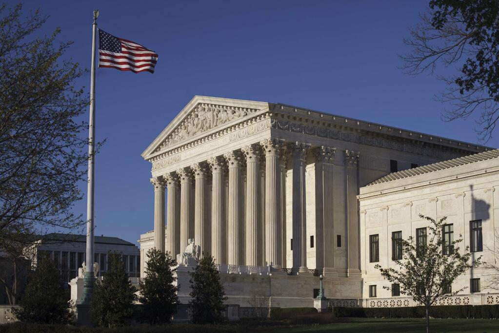 FILE - In this photo taken on Tuesday, April 4, 2017, the Supreme Court Building is seen in Washington. Supreme Court Justice Neil Gorsuch's earlier dissent as an appeals court judge in a case involving a New Mexico seventh-grader who was handcuffed and arrested after his teacher said the student had disrupted gym class with fake burps, means he probably won't have any role in considering it, should it come before the high court. (AP Photo/J. Scott Applewhite)