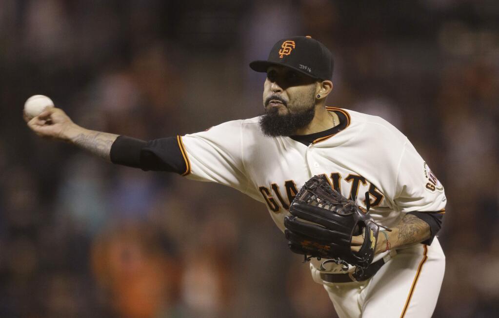 San Francisco Giants pitcher Sergio Romo works against the Colorado Rockies in the ninth inning Thursday, Sept. 29, 2016, in San Francisco. (AP Photo/Ben Margot)