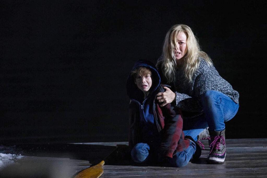 Naomi Watts as child psychiatrist Mary and Charlie Heaton as her son Stephen, haunted in their isolated home in 'Shut In.' (Europa Corp.)