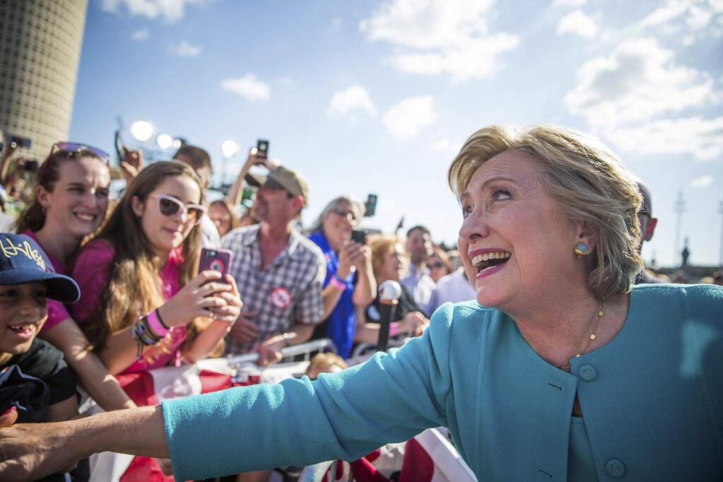 Democratic presidential nominee Hillary Clinton greets supporters following a 'Get out the vote,' rally at Curtis Hixon Waterfront Park, Wednesday, Oct. 26, 2016 in downtown Tampa, Fla. (Loren Elliot/Tampa Bay Times via AP)