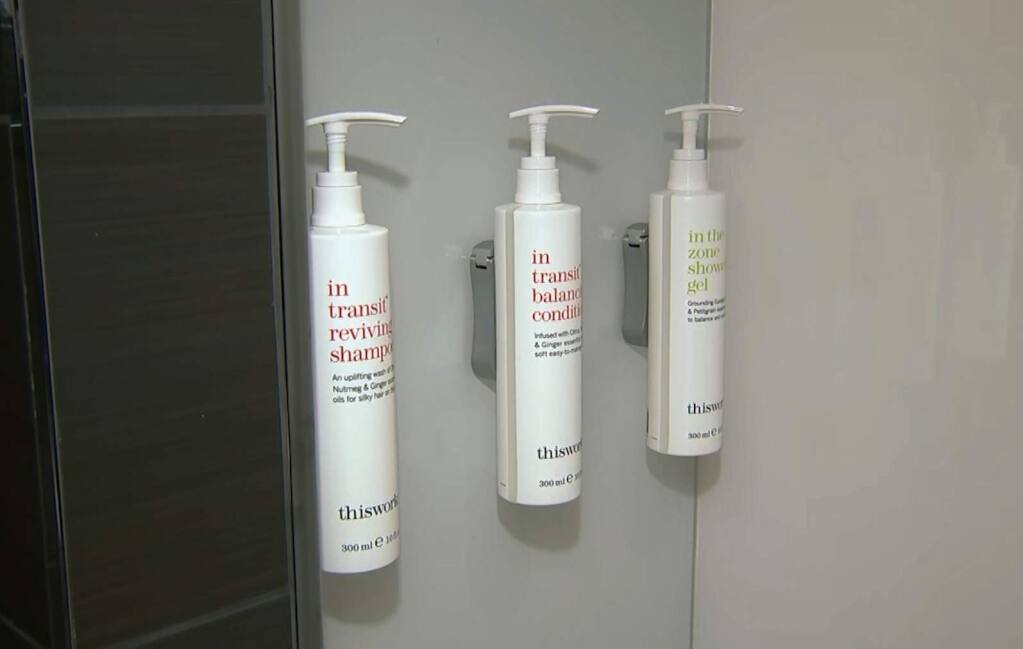 This image made from video shows bottles of shampoo, conditioner and shower gel that will replace smaller bottles of them by 2021, filmed at Marriott's headquarters in Bethesda, Md., Tuesday, Aug. 27, 2019. Marriott International, the world's largest hotel chain, said Wednesday it will eliminate small plastic bottles of shampoo, conditioner and bath gel from its hotel rooms worldwide by December 2020. They'll be replaced with larger bottles or wall-mounted dispensers, depending on the hotel. (AP Photo/Dan Huff)