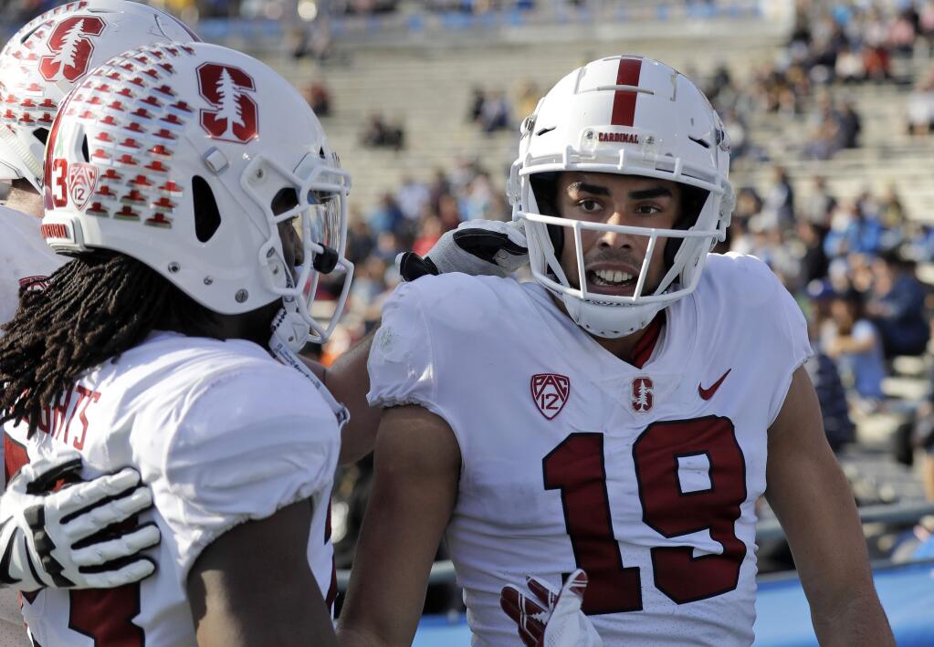 Stanford wide receiver JJ Arcega-Whiteside (19) celebrates his touchdown with teammates during the second half of an NCAA college football game against UCLA Saturday, Nov. 24, 2018, in Pasadena, Calif. (AP Photo/Marcio Jose Sanchez)