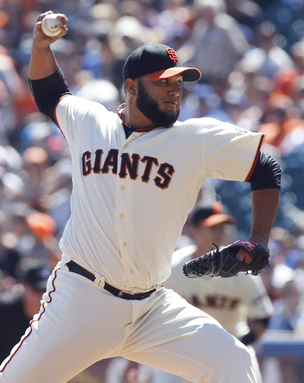 San Francisco Giants pitcher Yusmeiro Petit throws to the Los Angeles Dodgers during the first inning of a baseball game, Sunday, Sept. 14, 2014, in San Francisco. (AP Photo/George Nikitin)