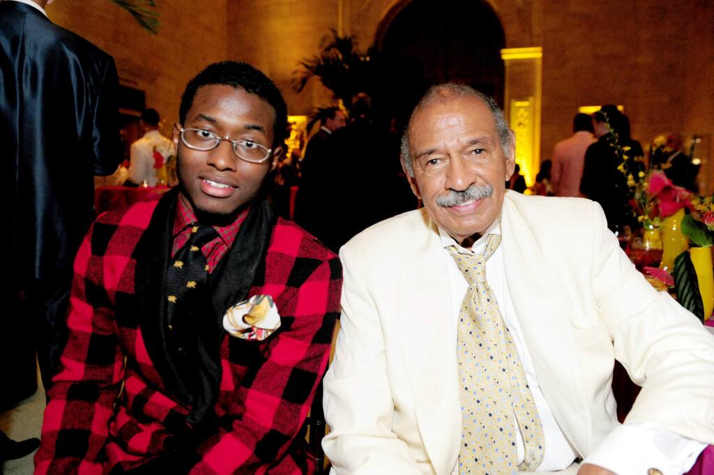 FILE - In this July 16, 2011 file photo, John Conyers, III poses with his father Rep. John Conyers, D-Mich., in Detroit. John Conyers' resignation from the U.S. House amid sexual harassment allegations unlocks the seat he's held for more than a half-century. The 88-year-old endorsed his son, political neophyte John Conyers III. Coleman Young II son of Detroit's first black mayor Coleman A. Young, plans Monday, Dec. 11, 2017, to announce his candidacy for the 13th Congressional District office vacated this week by Conyers. (Ricardo Thomas /Detroit News via AP File)