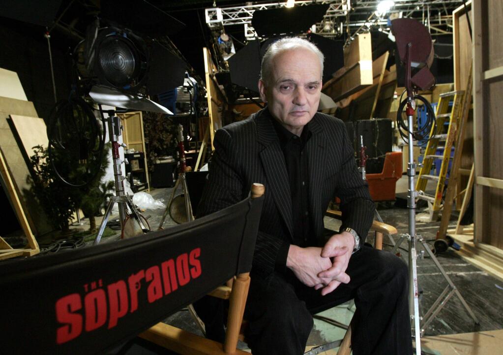 FILE - In this March 3, 2006 file photo, David Chase, creator and producer of the hit HBO series 'The Sopranos,' poses on a set in the Queens borough of New York. Warner Bros. Pictures says Thursday that New Line has purchased a screenplay for a “Sopranos” prequel from series creator David Chase and Lawrence Konner. The studio says the working title is “The Many Saints of Newark” and will be set in the 1960s during the Newark riots. Chase's acclaimed series about the mobster Tony Soprano played by the late James Gandolfini ran for six seasons on HBO and won 21 primetime Emmys. (AP Photo/Diane Bondareff, File)