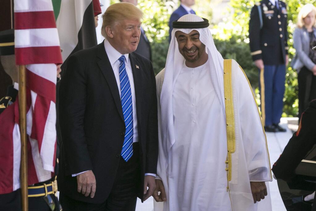 FILE - President Donald Trump welcomes Sheikh Mohammed bin Zayed Al Nahyan, the the de facto ruler of the United Arab Emirates, to the White House in Washington, May 15, 2017. Trump has allied himself with the Emirati crown prince, endorsing his strong support for Saudi Arabia and confrontational approaches toward Iran and Qatar. (Al Drago/The New York Times)