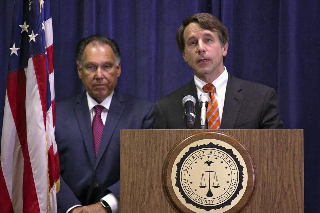 Insurance Commissioner Dave Jones, right, and Orange County District Attorney Tony Rackauckas address reporters on April 20, 2017 at a news conference in Santa Ana to announce charges against two dozen defendants in an alleged $40 million insurance scheme. (DEPARTMENT OF INSURANCE)