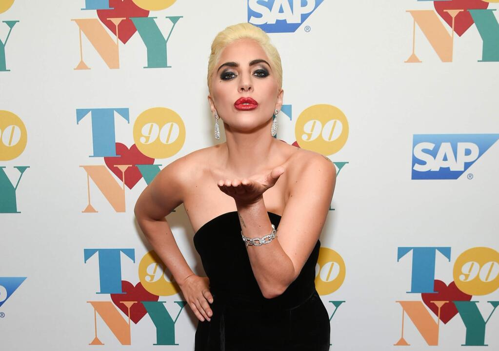 FILE - In this Wednesday, Aug. 3, 2016 file photo, singer Lady Gaga attends Tony Bennett's 90th birthday celebration at the Rainbow Room at Rockefeller Plaza in New York. Warner Bros. announced Tuesday, Aug. 16, 2016, that Lady Gaga and Bradley Cooper are starring in a remake of 'A Star is Born.' The film will mark both the singer-actress' first leading role in a movie and the directorial debut of the 'American Sniper' and 'Silver Linings Playbook' actor-producer. (Photo by Evan Agostini/Invision/AP, File)