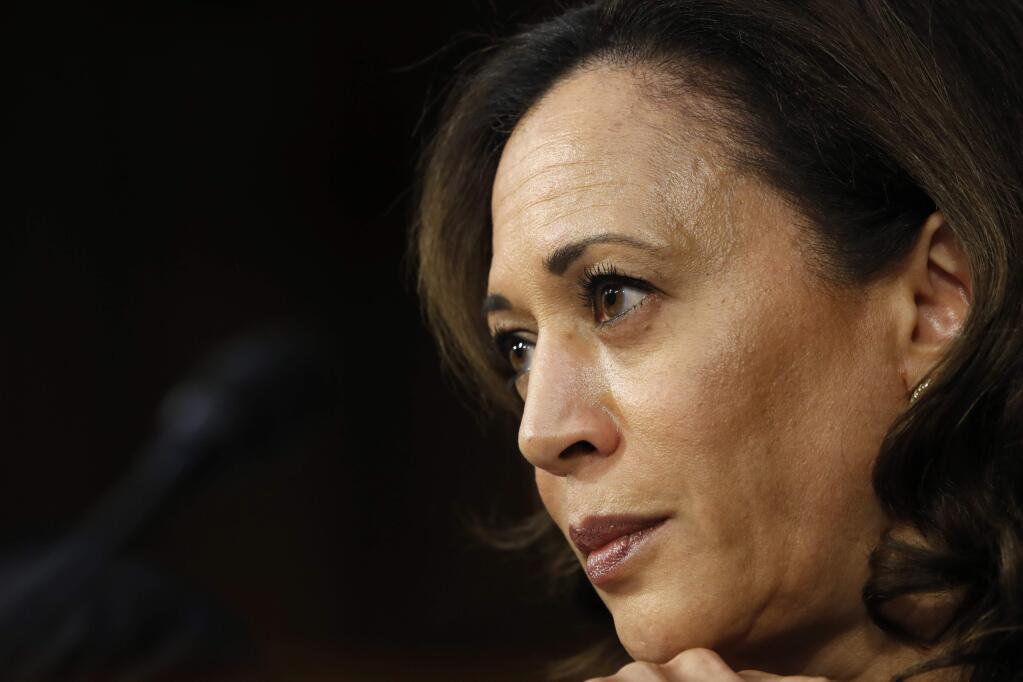 FILE- In this Sept. 6, 2018, file photo Sen. Kamala Harris, D-Calif., listens as President Donald Trump's Supreme Court nominee, Brett Kavanaugh, answers her question during the third day of Kavanaugh's Senate Judiciary Committee confirmation hearing on Capitol Hill in Washington. (AP Photo/Jacquelyn Martin, File)