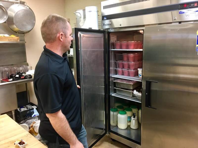The cupboard was NOT bare, as Cody Williams surveyed the day's smoothie stock for SVUSD students.