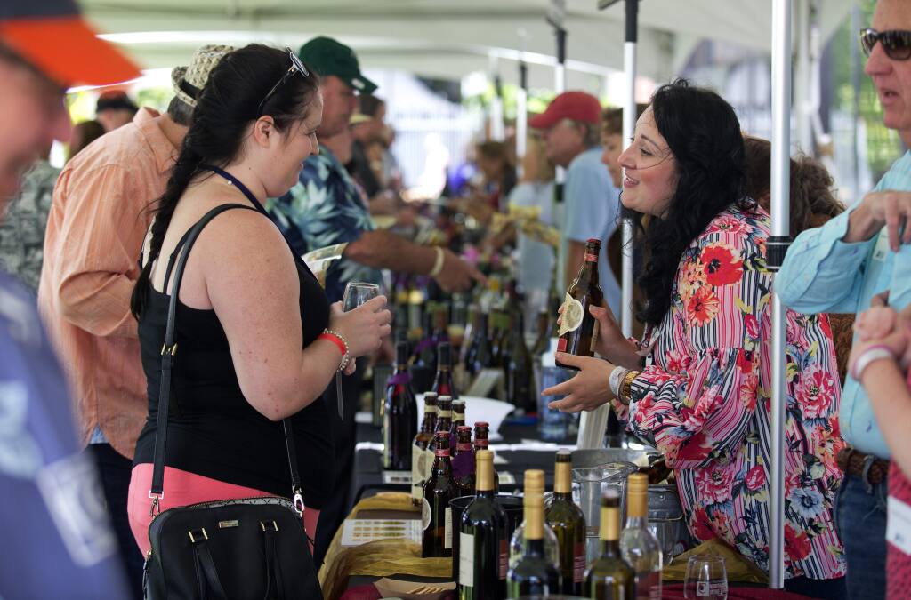 This file photo shows the North Coast Wine and Food Festival at Sonoma Mountain Village in Rohnert Park.  The event returns this weekend at the Luther Burbank Center for the Arts in Santa Rosa. (John Burgess/The Press Democrat file)