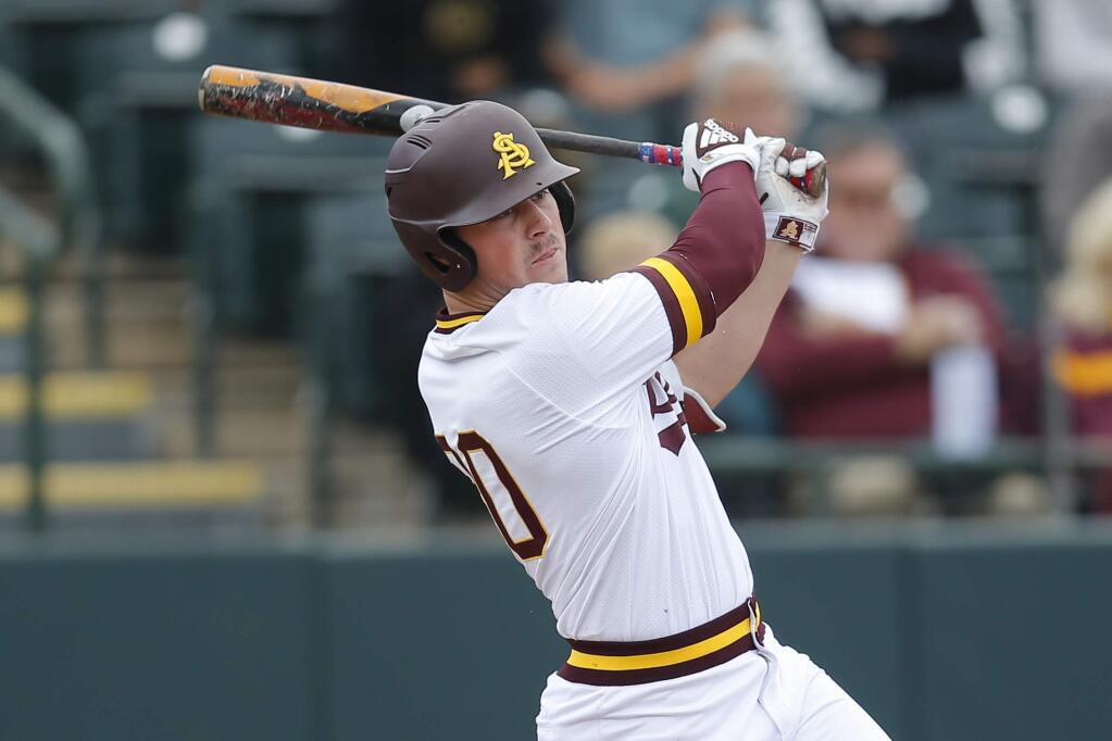 In this Feb. 17, 2019, file photo, Arizona State's Spencer Torkelson bats during an game against Notre Dame in Phoenix. Torkelson is only the third player in Pac-12 history to hit 20 home runs in back-to-back seasons and is a projected top-three pick in the draft. (AP Photo/Rick Scuteri, File)