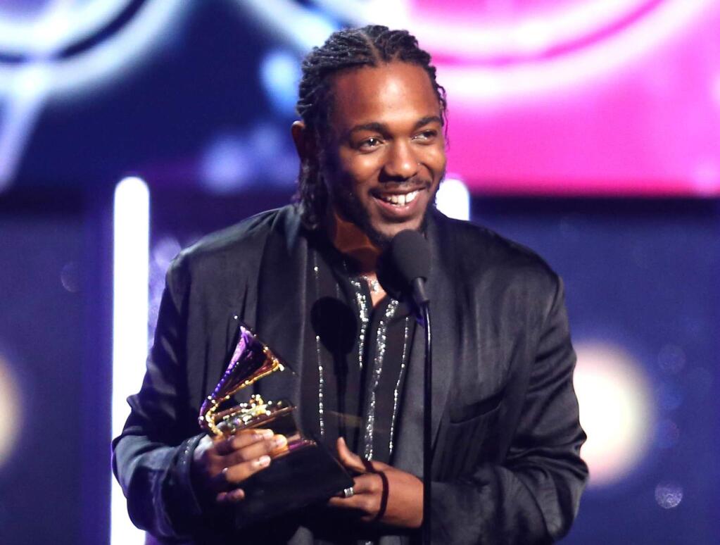 FILE - In this Jan. 28, 2018 file photo, rapper Kendrick Lamar accepts the award for best rap album for 'Damn' at the 60th annual Grammy Awards in New York. On Monday, April 16, 2018, Lamar won the Pulitzer Prize for music for his album 'Damn.' (Photo by Matt Sayles/Invision/AP, File)