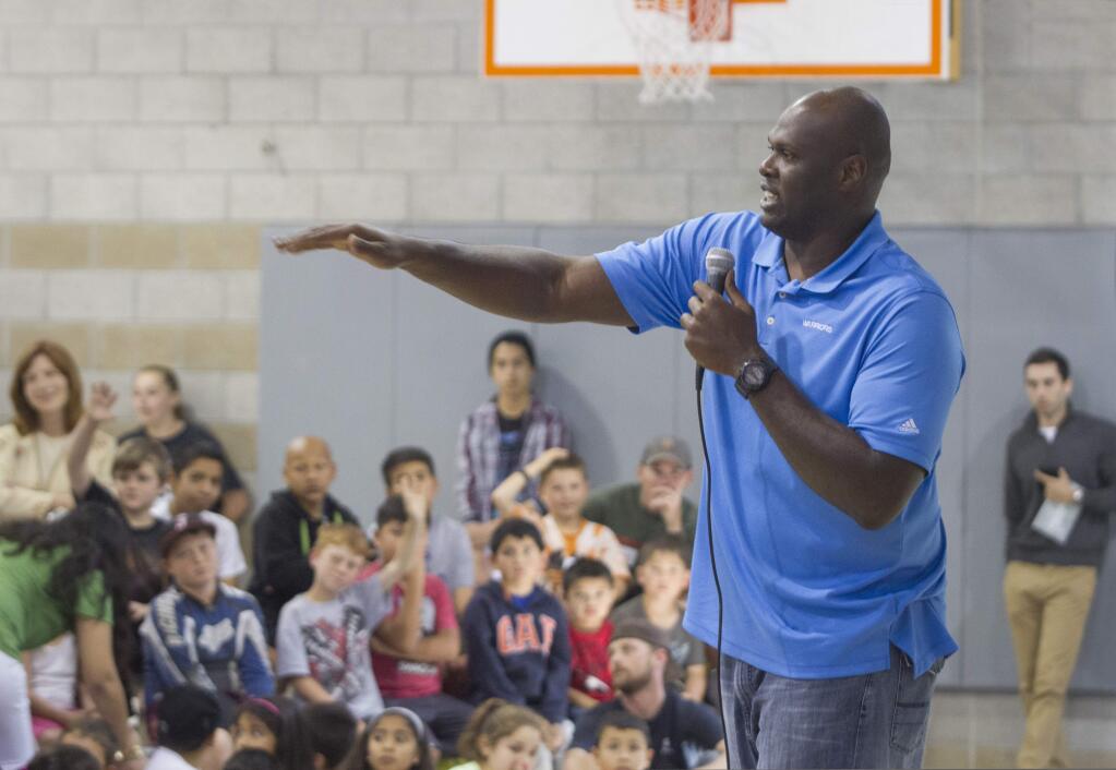 Former NBA Warriors player Adonal Foyle entertained young hoops fans at the Boys and Girls Club in Maxwell Park last Friday. He emphasized the importance of a college education and gave game pointers to athletic hopefuls. (Photos by Robbi Pengelly/Index-Tribune)