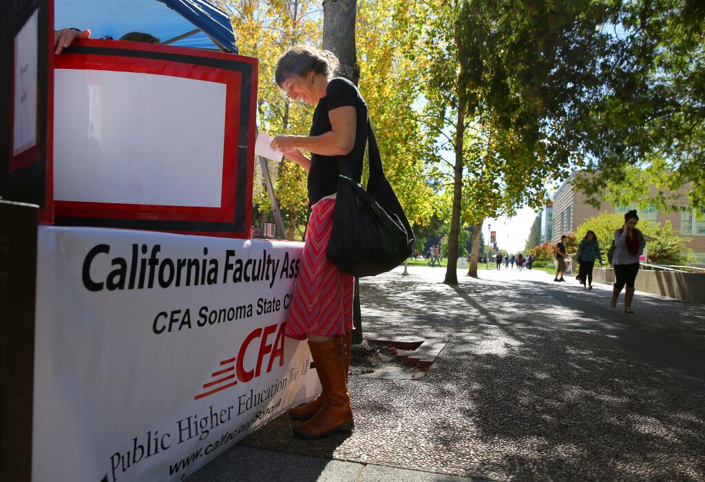 Nina Kilhan, an adjunct professor in the geology department, marks her ballot, as the California Faulty Association Sonoma State Chapter holds a Strike Authorization Vote at Sonoma State University, in Rohnert Park on Monday, October 19, 2015. (Christopher Chung/ The Press Democrat)