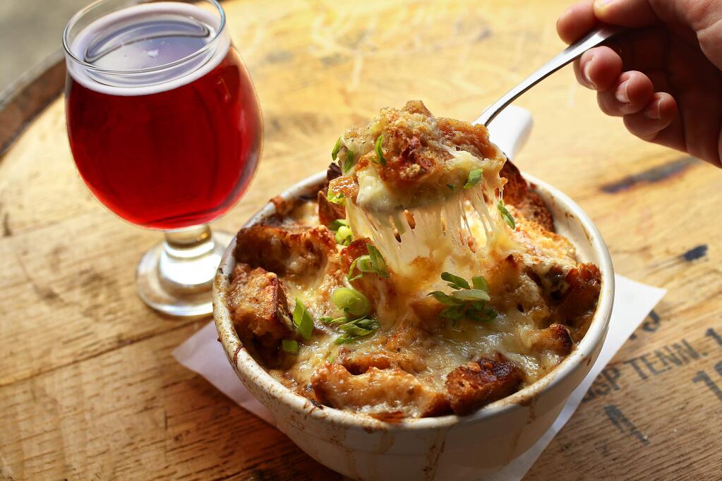 French Onion Soup with sweet onions caramelized in Sonoma Cider Apple Brandy, simmered in bone broth, croutons & melted gruyere cheese from the Sonoma Cider Taproom in Healdsburg. (John Burgess/The Press Democrat)