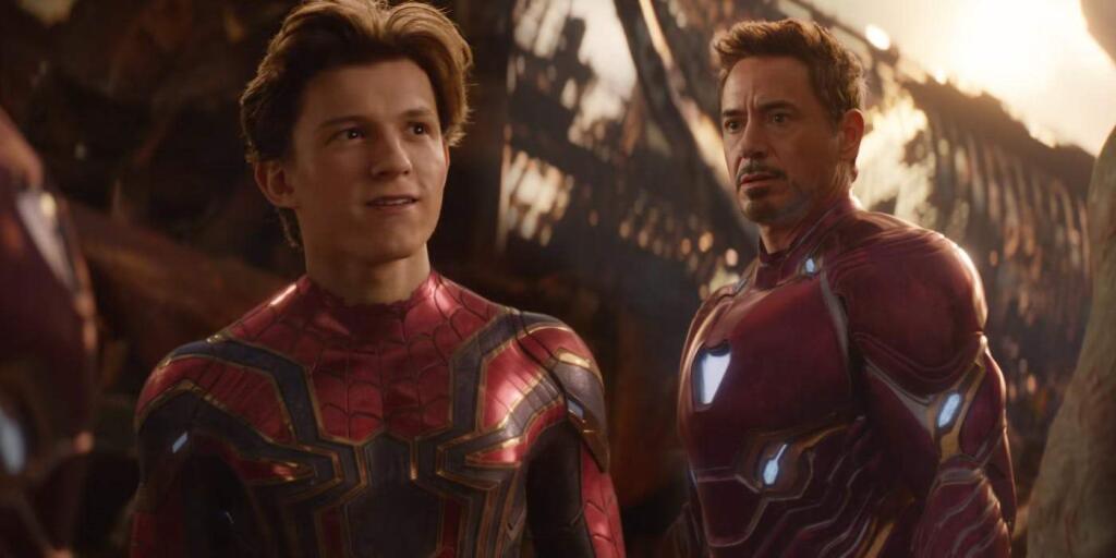 Tom Holland as Spider Man and Robert Downey as Iron Man.