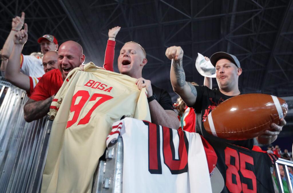 San Francisco 49ers' supporters cheer for their team during Opening Night for the NFL Super Bowl 54 football game Monday, Jan. 27, 2020, at Marlins Park in Miami. (AP Photo/Chris Carlson)