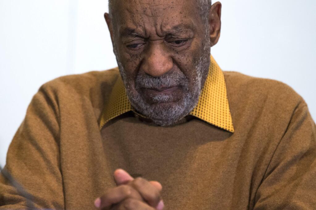 FILE - In this Nov. 6, 2014 file photo, entertainer Bill Cosby pauses during a news conference. Cosby's attorney said Sunday, Nov. 16, 2014 that Cosby will not dignify 'decade-old, discredited' claims of sexual abuse with a response, the first reaction from the comedian to an increasing uproar over allegations that he sexually assaulted several women in the past. (AP Photo/Evan Vucci, File)