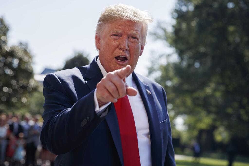 In this Aug. 9, 2019, photo, President Donald Trump talks to reporters on the South Lawn of the White House in Washington. (AP Photo/Evan Vucci)