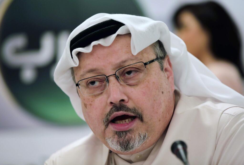 FILE - In this Dec. 15, 2014, file photo, Saudi journalist Jamal Khashoggi speaks during a press conference in Manama, Bahrain. An independent U.N. human rights expert says authorities in Saudi Arabia quietly held a second court hearing for 11 people facing charges over the killing of Khashoggi. Khashoggi, a Washington Post columnist who wrote critically about Saudi Crown Prince Mohammed bin Salman, was killed inside the Saudi Consulate in Istanbul on Oct. 2, 2018. (AP Photo/Hasan Jamali, File)