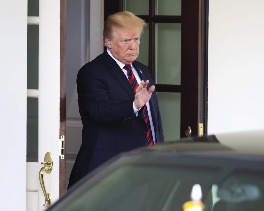 President Donald Trump waves to visiting South Korean President Moon Jae-in as he leaves the White House in Washington, following their meeting, Tuesday, May 22, 2018. (AP Photo/Manuel Balce Ceneta)