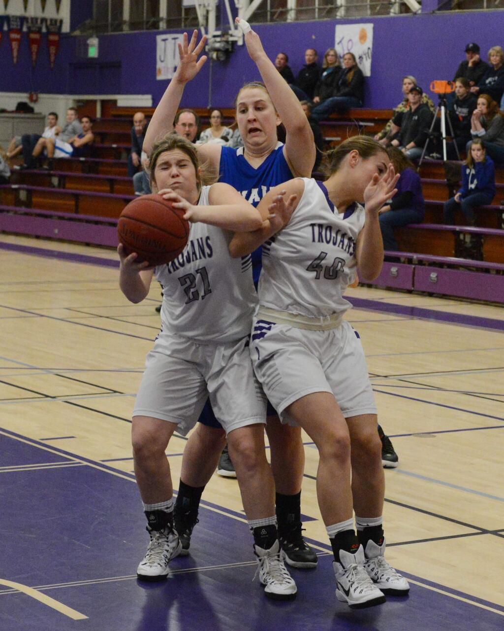 SUMNER FOWLER/FOR THE ARGUS-COURIERPetaluma's Cassie Baddeley bumps into teammate Joelle Krist as she tries to go up for a shot in a 70-59 win over Analy in a SCL playoff game.