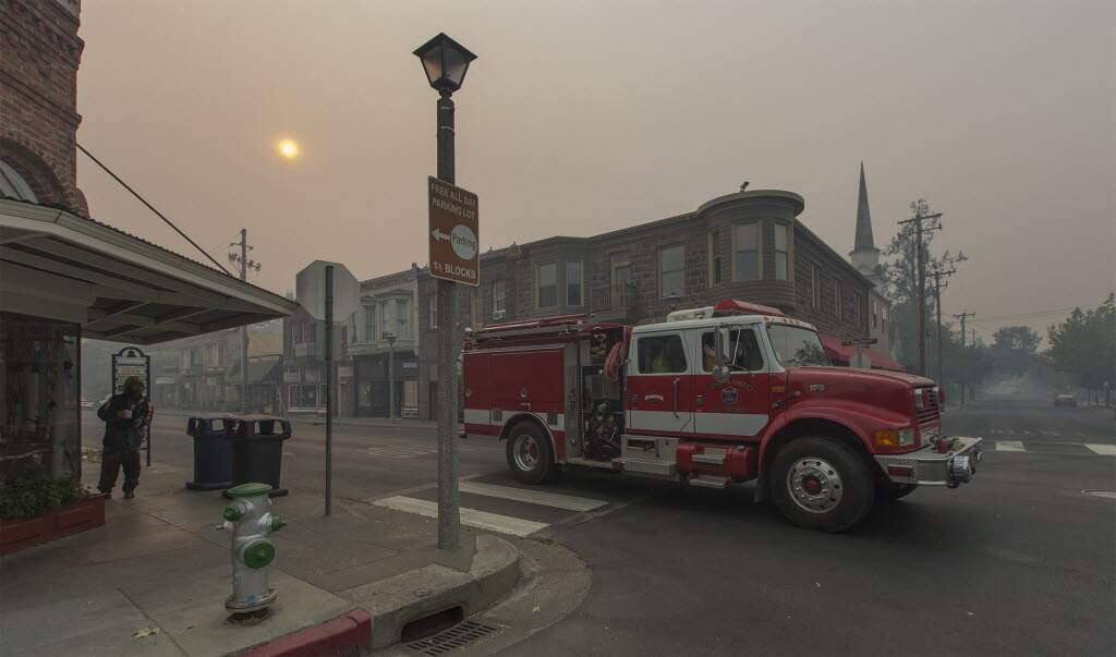 The corner of West Napa and First Street West in downtown Sonoma was deserted the morning of Oct. 13, save for a lone Sonoma Valley fire truck wending its way through past the Plaza. (Robbi Pengelly/Index-Tribune)