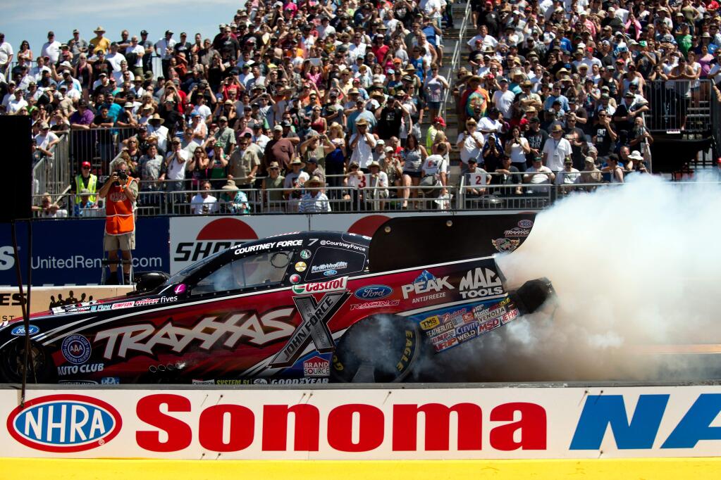 Courtney Force warms up her tires during the first round of racing at NHRA Sonoma Nationals at Sonoma Raceway in Sonoma, California, on July 27, 2014. (Alvin Jornada / For The Press Democrat)