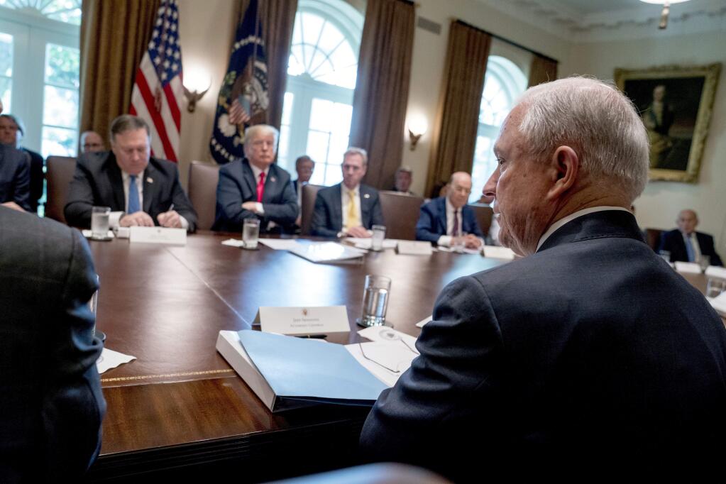 President Donald Trump, second from left, listens as Attorney General Jeff Sessions, right, speaks during a cabinet meeting in the Cabinet Room of the White House, Thursday, Aug. 16, 2018, in Washington. (AP Photo/Andrew Harnik)