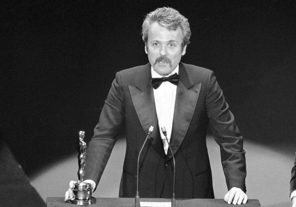 FILE - In this March 28, 1977 file photo, William Goldman accepts his Oscar at Academy Awards in Los Angeles, for screenplay from other medium for 'All The President's Men.' Goldman, the Oscar-winning screenplay writer of “Butch Cassidy and the Sundance Kid” and “All the President's Men” William Goldman died, Friday, Nov. 16, 2018. He was 87. (AP Photo, File)