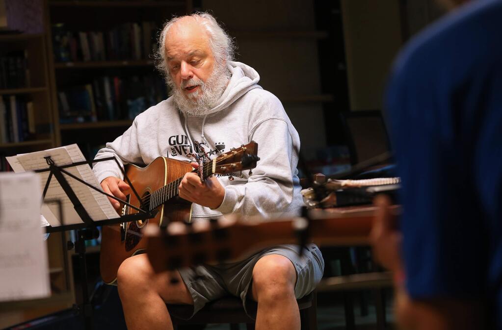 Joe Zizzi sings and plays along during a Guitars for Vets practice session in Santa Rosa on Wednesday, September 18, 2019. (Christopher Chung/ The Press Democrat)