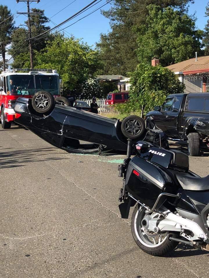 A Santa Rosa driver swerved into a parked pickup on Corby Avenue and flipped his Acura sedan Tuesday, Sept. 10, after dropping his cell phone. (Santa Rosa Police Department/Facebook)