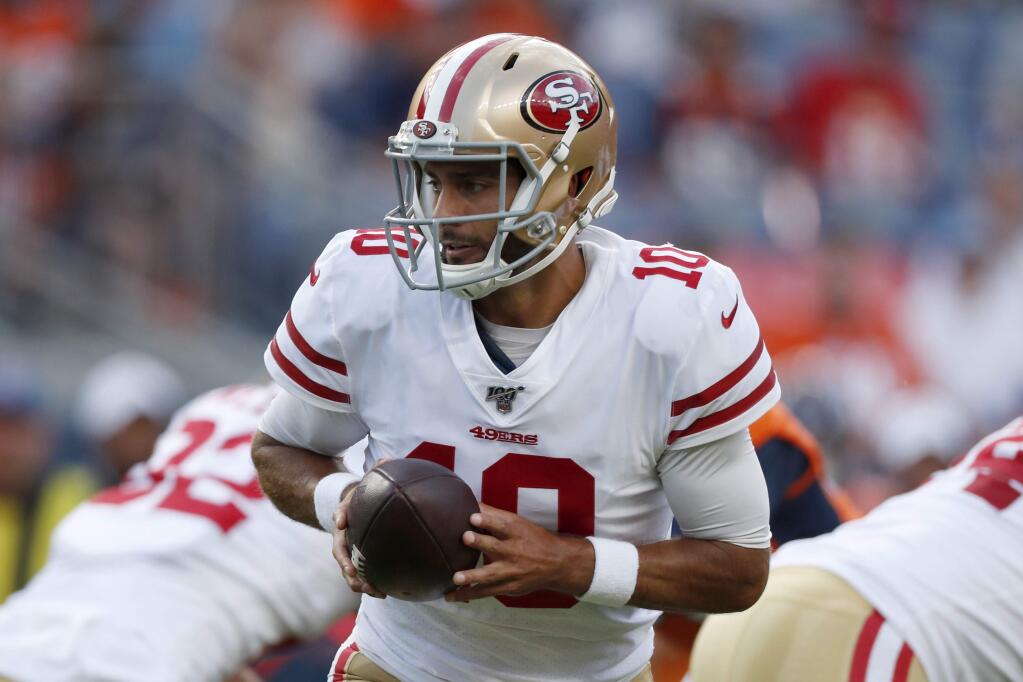 In this Aug. 19, 2019, file photo, San Francisco 49ers quarterback Jimmy Garoppolo looks to hand the ball off during the first half of the team's preseason game against the Denver Broncos in Denver. (AP Photo/David Zalubowski, File)