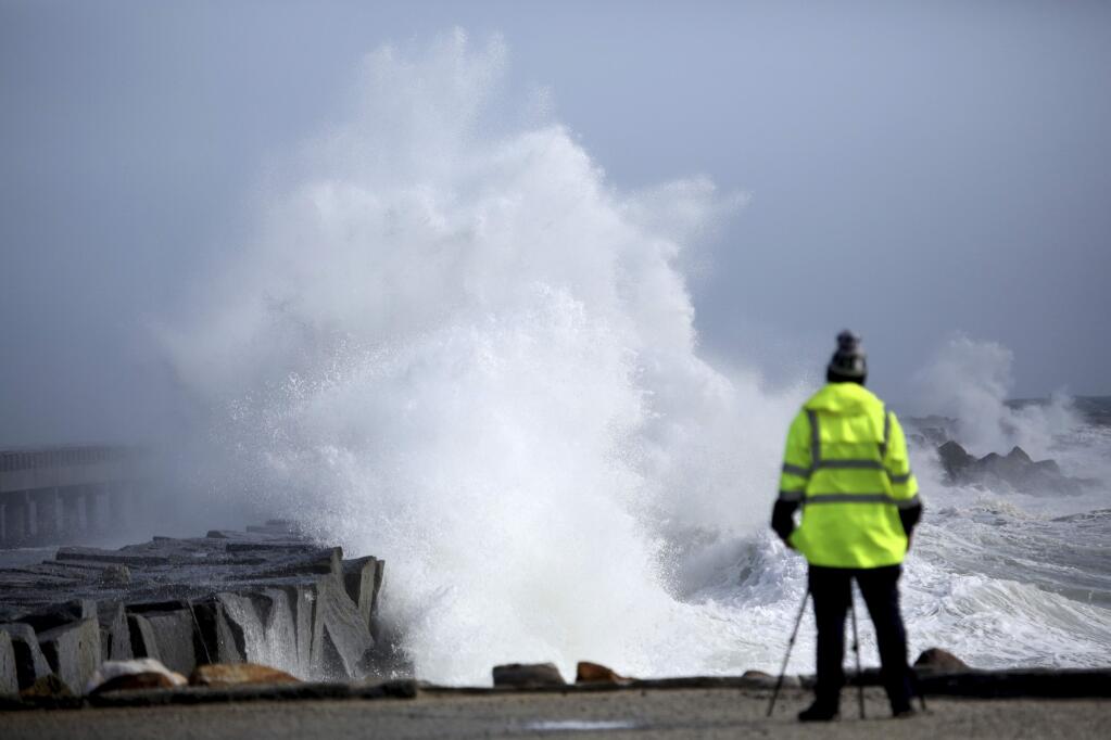 High surf pounds the breakwater in San Pedro, Cailf. at the Port of Los Angeles, on Friday, Jan. 20, 2017. Along the coast, big surf was rolling ashore, and forecasters said waves could build to 30 feet on the Central Coast. (Chuck Bennett /The Daily Breeze via AP)