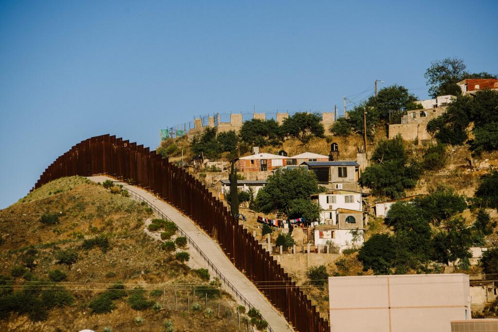 FILE-- The United States-Mexico border near Nogales, Ariz., June 20, 2018. Facing a surge in migrant families entering the U.S. and with the midterm elections two weeks away, the Trump administration is weighing an array of new policies that it hopes will deter Central Americans from journeying north. (Ryan Christopher Jones/The New York Times)