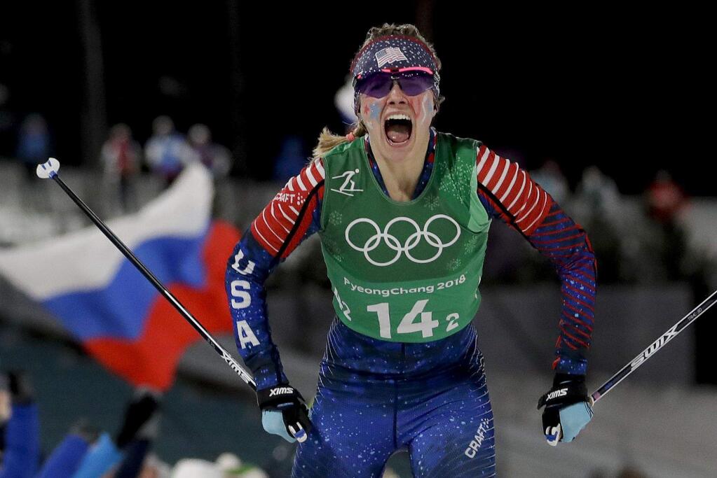 Jessica Diggins, of the United States, celebrates after winning the gold medal in the women's team sprint freestyle cross-country skiing final at the 2018 Winter Olympics in Pyeongchang, South Korea, Wednesday, Feb. 21, 2018. (AP Photo/Matthias Schrader)