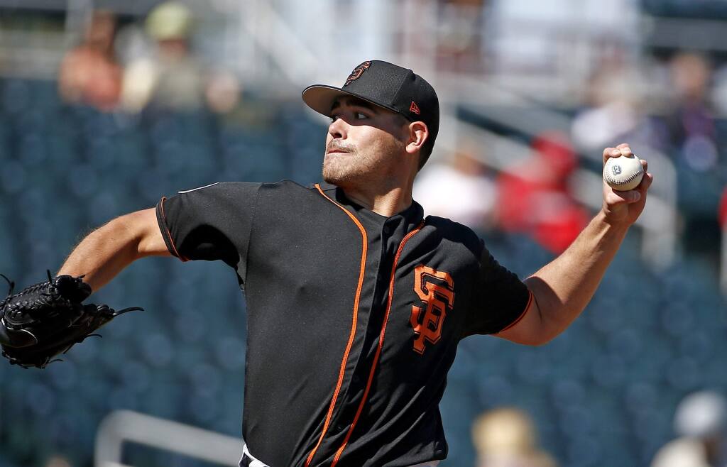 San Francisco Giants starting pitcher Matt Moore throws a pitch against the Cincinnati Reds during the first inning of a spring training baseball game, Sunday, Feb. 26, 2017, in Goodyear, Ariz. (AP Photo/Ross D. Franklin)