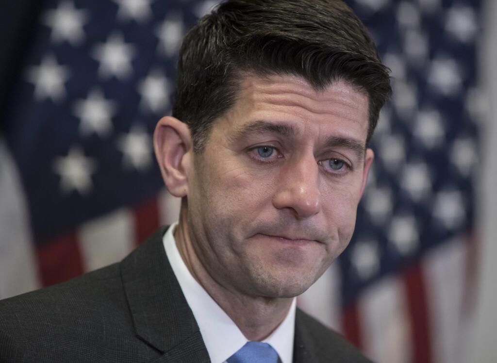 Speaker of the House Paul Ryan, R-Wis., meets with reporters following a closed-door Republican strategy session on Capitol Hill in Washington, Tuesday, March 20, 2018. Ryan says he's hoping bargainers can resolve the final disputes in a government-wide spending bill in time for Congress to begin voting Thursday on the measure. (AP Photo/J. Scott Applewhite)